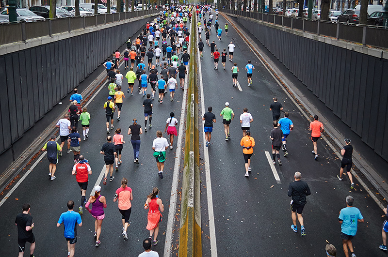 man running uphill in a race