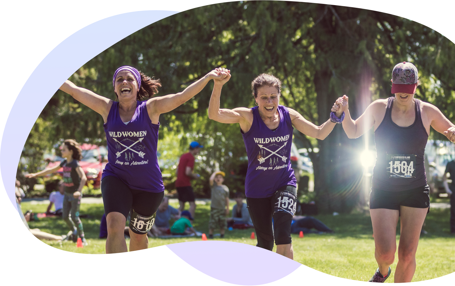 Three women holding hands and running