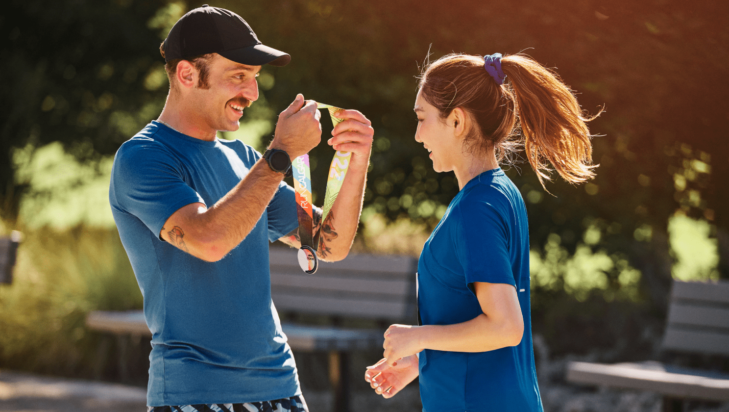 Man giving woman medal