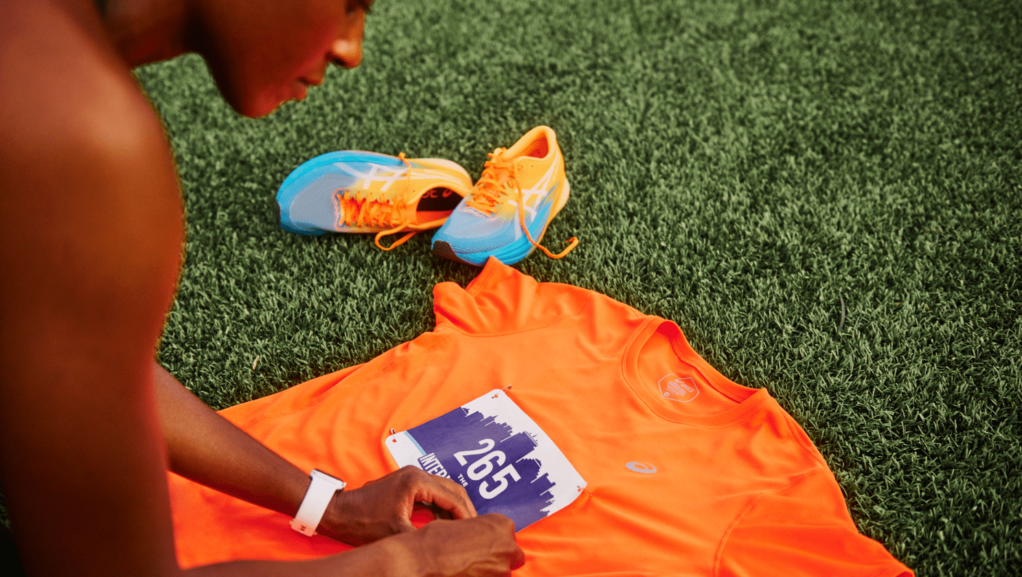 Person attaching bib to shirt